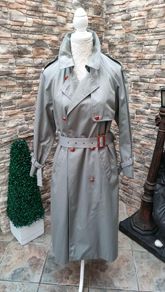Vintage Nuage ladies trenchcoat Approximately late 90s early 00s Size 10 on label The colour is a pale bluey grey with brown buttons It's got an inner lining that can be removed