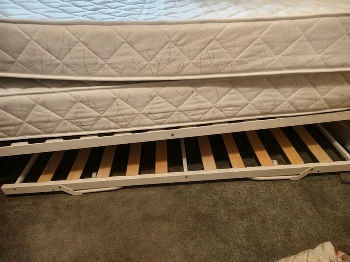 Single bed with pullout bed underneath