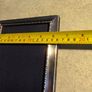 A sterling silver glazed photo frame in total dimensions 8 1/4 x  x 6 1/4 inches take photo 7 x 5 inches. Set with velvet mounts in very good condition. Image 7