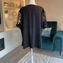 Ladies Black Short-sleeve Top Features Sheer polka-dot mesh sleeves Image 8