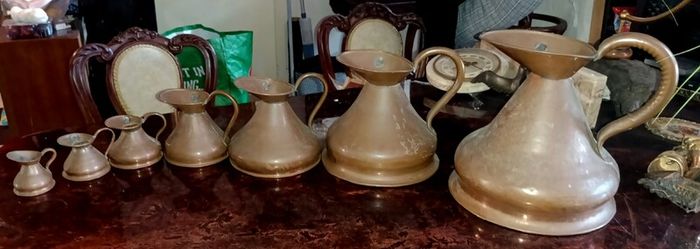 Antique Haystack copper jug set of 7