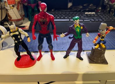 4 Comic book figures Spider-Man Joker Thor