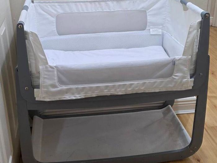 Dark gray bed side cot.