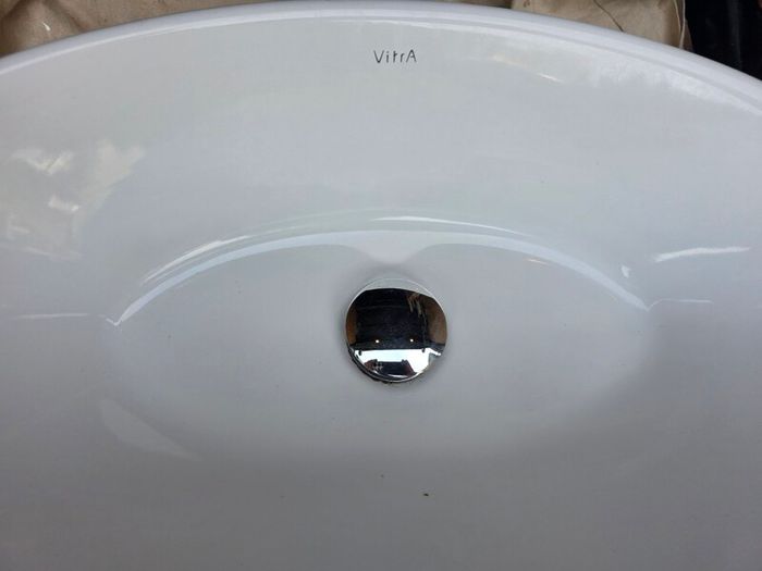 Countertop basin with countertop mounted tap