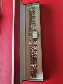 silver watch and matching bracelet