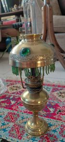 Antique petit brass oil lamp with green beaded garland
