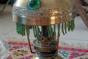 Antique petit brass oil lamp with green beaded garland