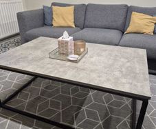 Concrete-effect coffee table with black metal frame