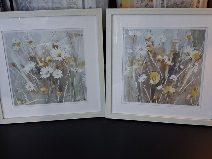 Set of floral pictures in frames