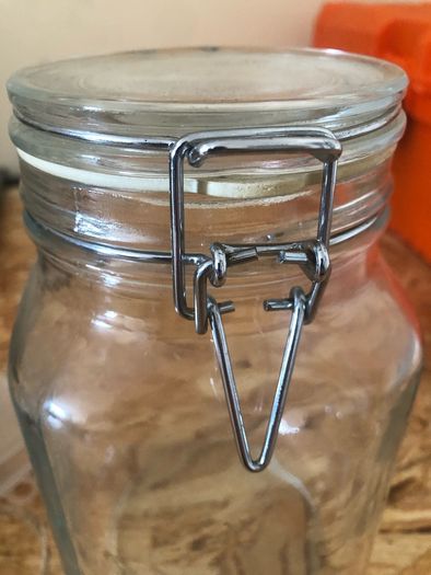 Airtight glass storage jar with clasp