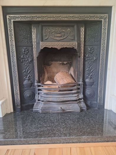 Castiron fireplace and surround plus marble mantlepiece and black stone heart