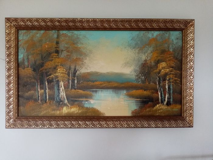 Painting of mountains lake and trees