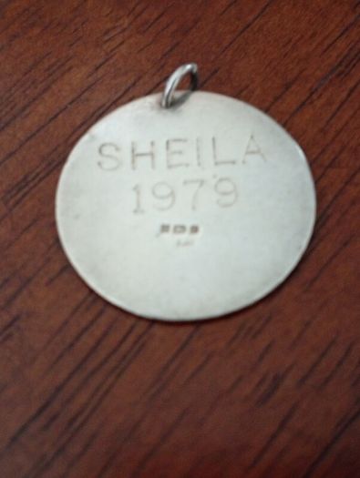 Sterling silver charm.