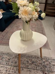 Side table with flowers and pot