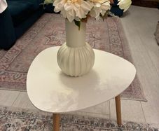 Side table with flowers and pot