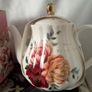 Gift set of a teapot, mug, spoon and coaster. Image 4