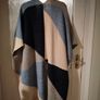 Monsoon Colourblock Knit Poncho. The design features an abstract, geometric color-block pattern with shades of blue, grey, and cream and Navy. Image 2