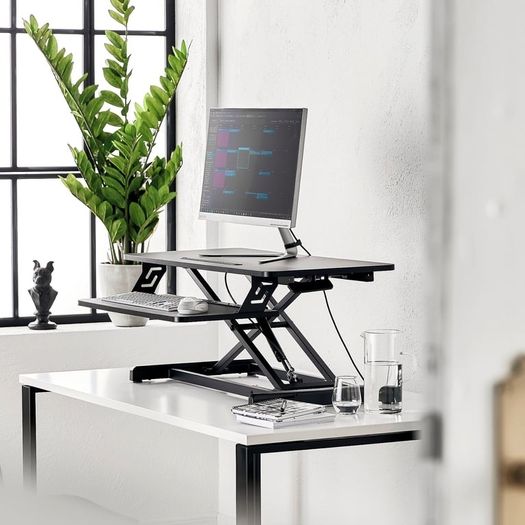 Hydraulic sitting/standing desk
