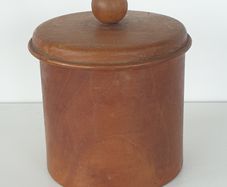 Turned round wooden box with lid