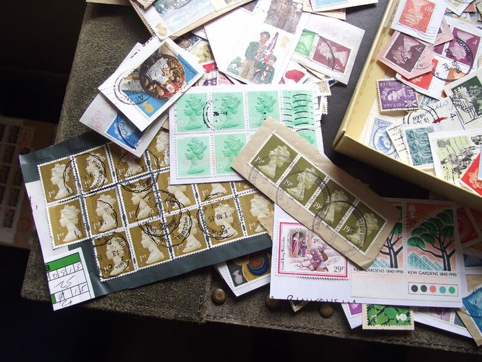 A box with collection of stamps from Great Britain