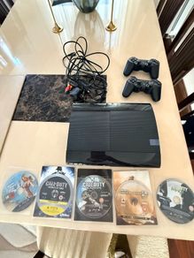 PS3 Console + 2 DualShock controllers + 6 games