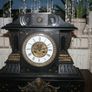 Victorian French Black Slate Mantle Clock (Very large and heavy) with bronze ornamentation Oversized. Open escarpment slate plate Roman numerals. Circa 1890s. Accented with Trojan head. Flanked by two Hellenistic ladies heads on sides. Rose cartouche mask Image 3