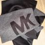 Authentic Michael Kors reversible knit scarf in charcoal black/heather grey with oversized MK logo detail. Image 7