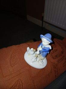 Figurine of a young Boy, 3 ducks