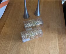 4 napkin holders (new) and 2 used candlesticks