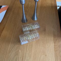 4 napkin holders (new) and 2 used candlesticks