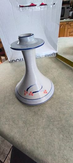 3 different itmes- 1- pottery modern design handmade candle holder 18.00 euro. 2-  red enamel candlestick holder and drip tray featuring a Considered by Helen James 12.00 euro. 3-  PAPERWEIGHT 15.00 euro