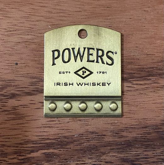 Powers whiskey medal