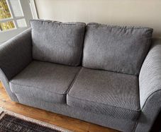 Two-seater grey fabric Sofa Bed