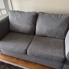Two-seater grey fabric Sofa Bed