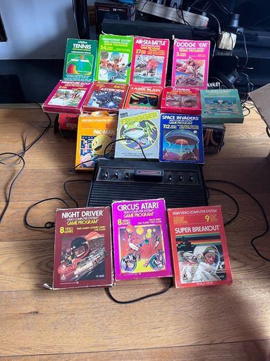 Atari 2600 Space Invaders Woody Atari 2600 with 15 individual games and 14 game Indy 500 driving
