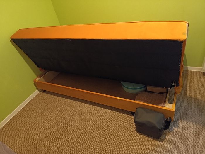 Yellow velvet sofa bed with storage