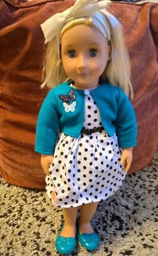Two Our Generation dolls with outfits