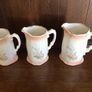 A set of 3 Large Peach Floral porcelain Graduating jugs Image 3