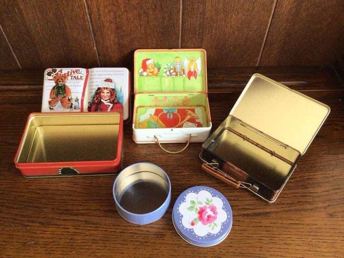 A collection of 4 Small tins
