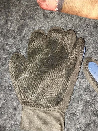 A pair of pet grooming and deshedding glove and Cigar designed toy for dogs