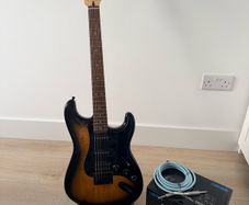 Squier stratocaster by fender, Boss amp and accessories