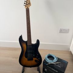 Squier stratocaster by fender, Boss amp and accessories