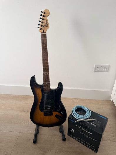 Squier stratocaster by fender, Boss amp and accessories