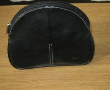 Black faux leather cosmetics bag with gold zip