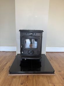 Solid fuel stove with back boiler