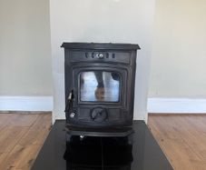 Solid fuel stove with back boiler