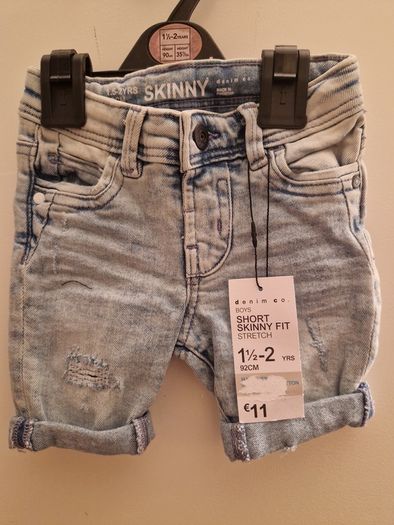 A selection of brand new baby clothes and items
