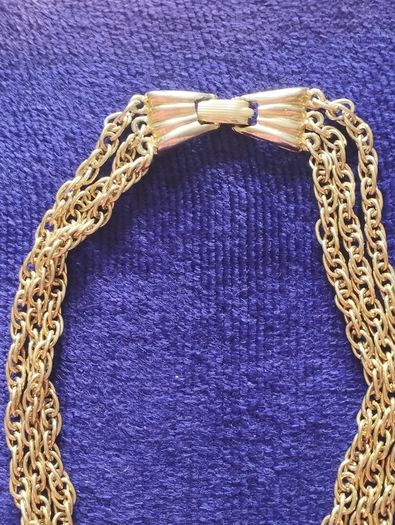 Vintage gold tone multi chain necklace with beautiful clasp.
