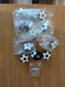 12 football shaped cabinet/drawer knobs, 4 used and 8 unused