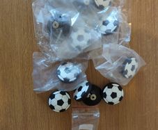 12 football shaped cabinet/drawer knobs, 4 used and 8 unused